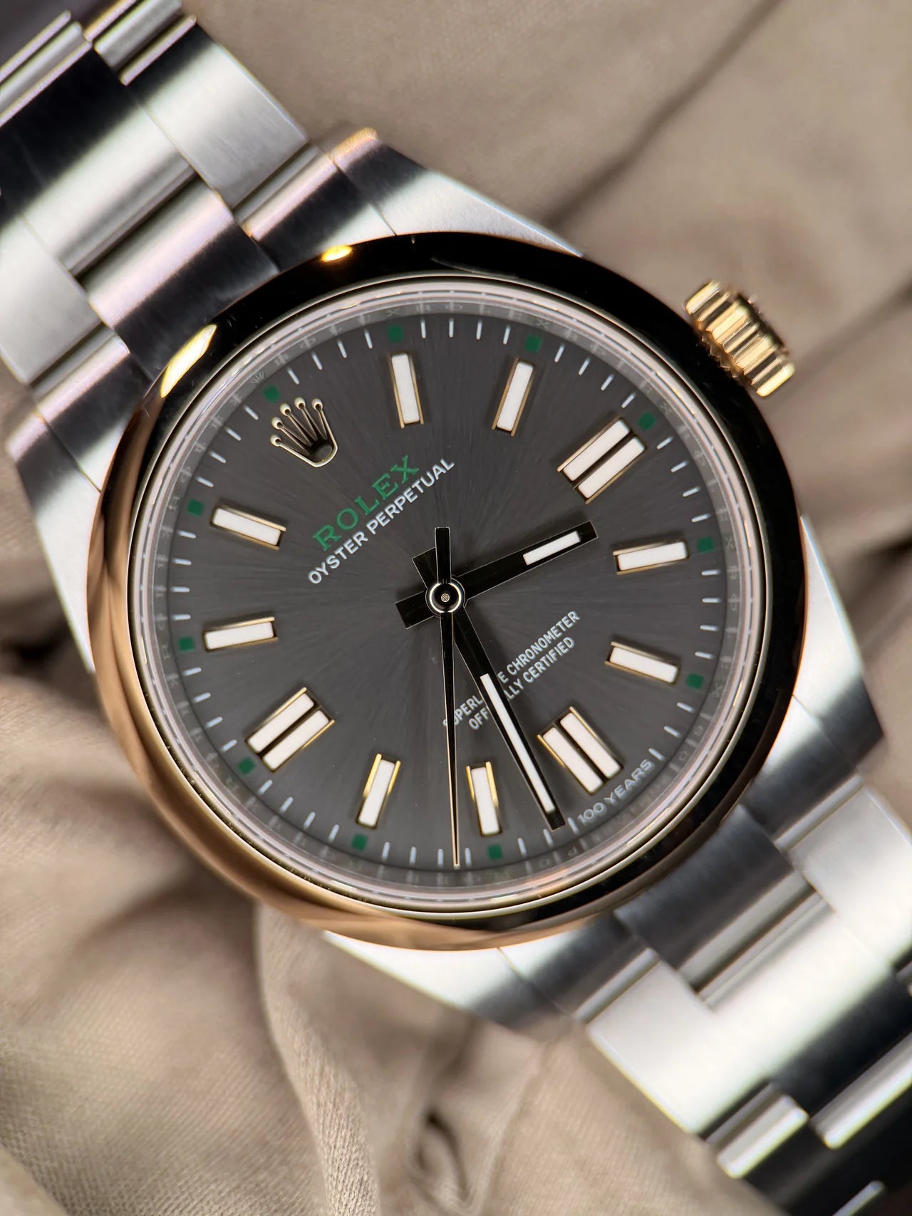 Dark dial steel watch with a smooth bezel