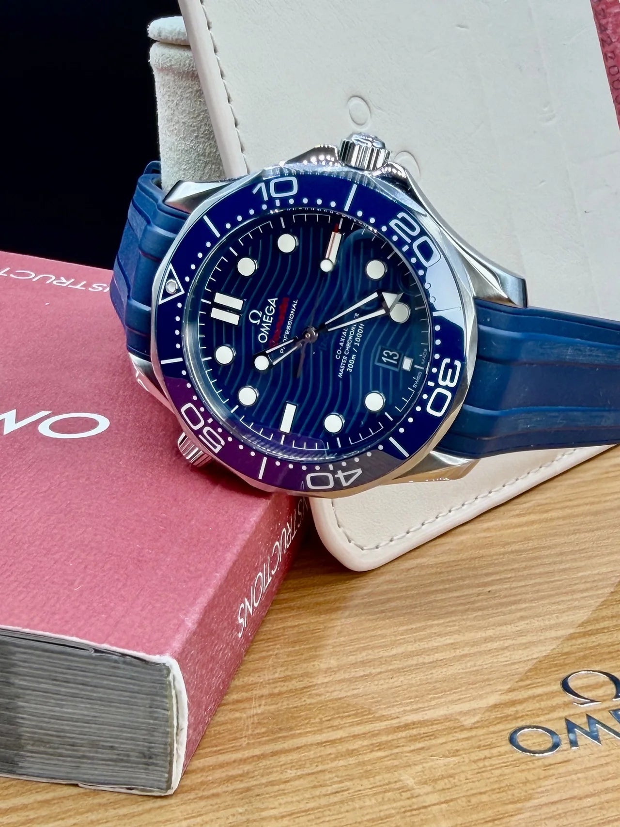 Blue diving watch on a blue rubber strap