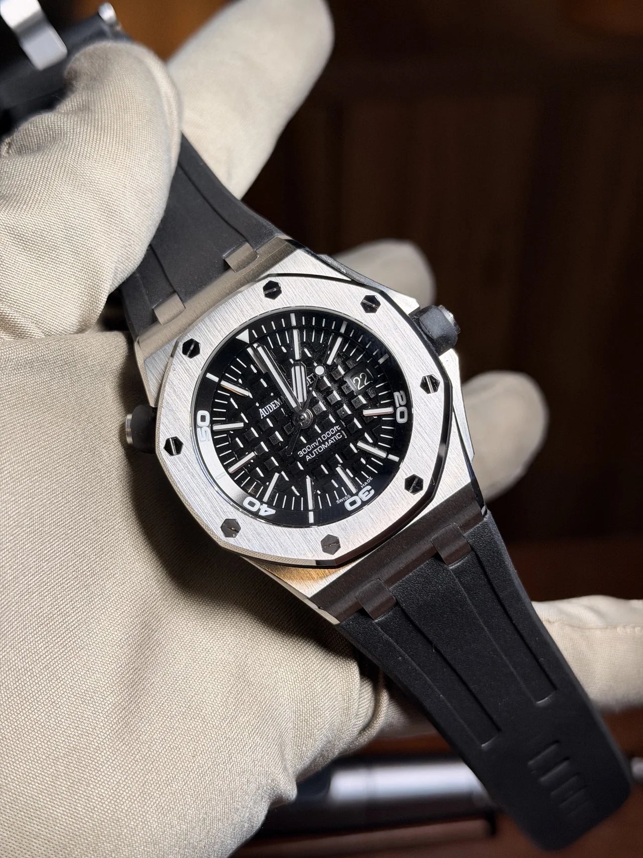 Dark dial chronograph with an octagonal bezel and rubber strap
