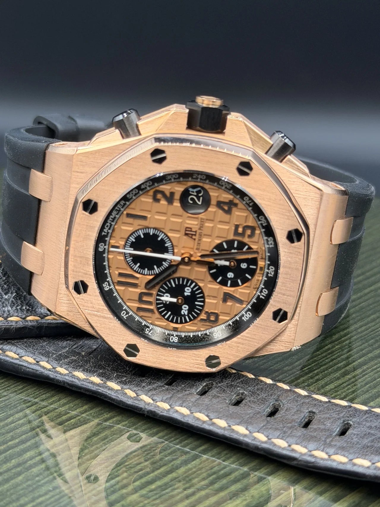 Gold-tone chronograph with a dark rubber strap