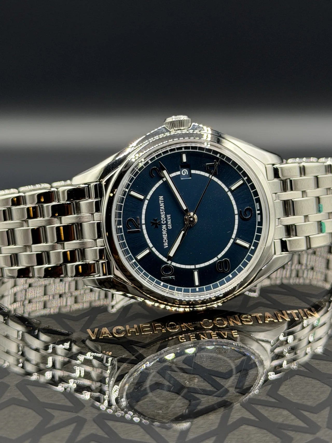 Blue dial watch with a polished steel bracelet