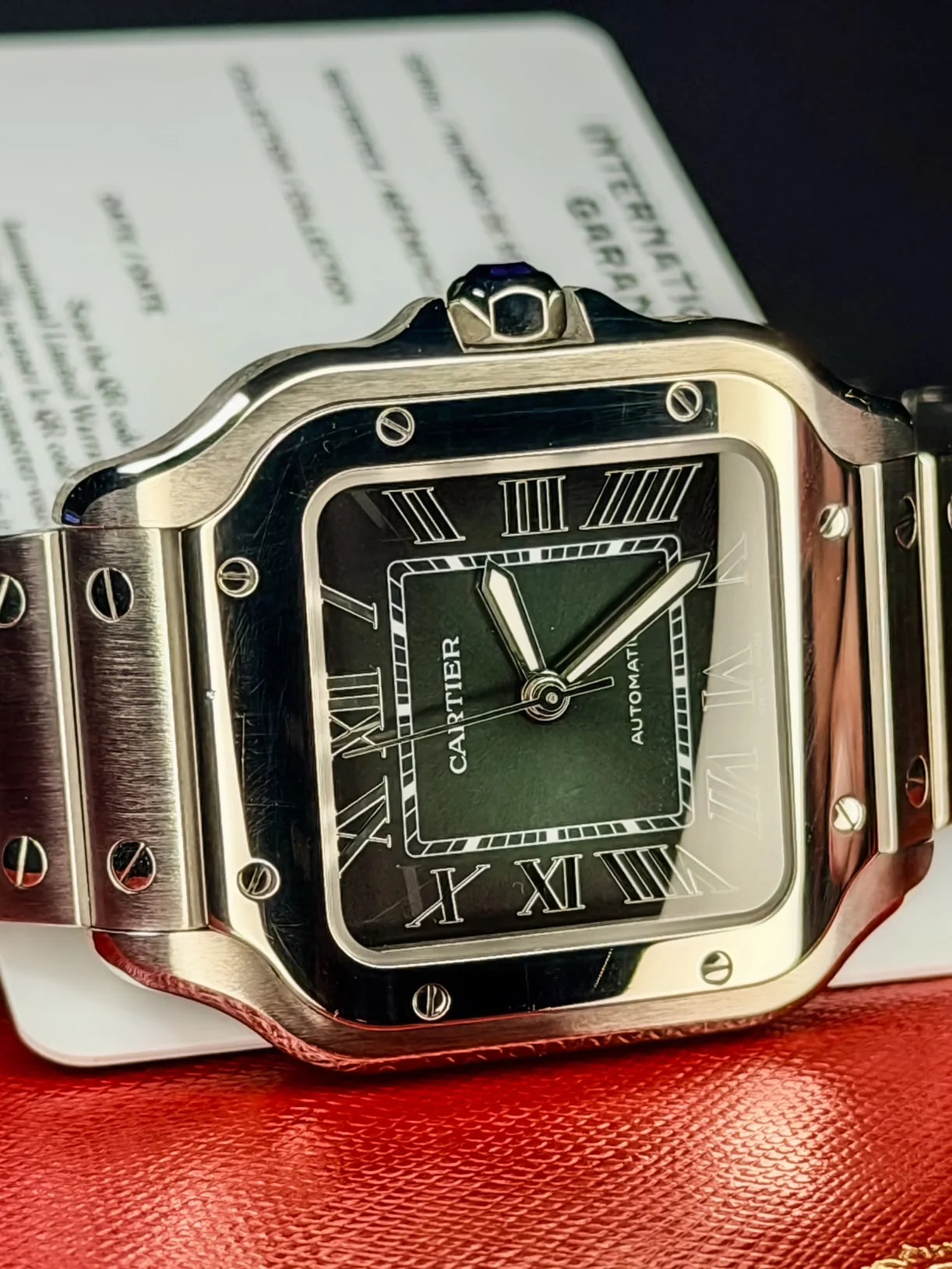 Square green dial watch with a steel bracelet
