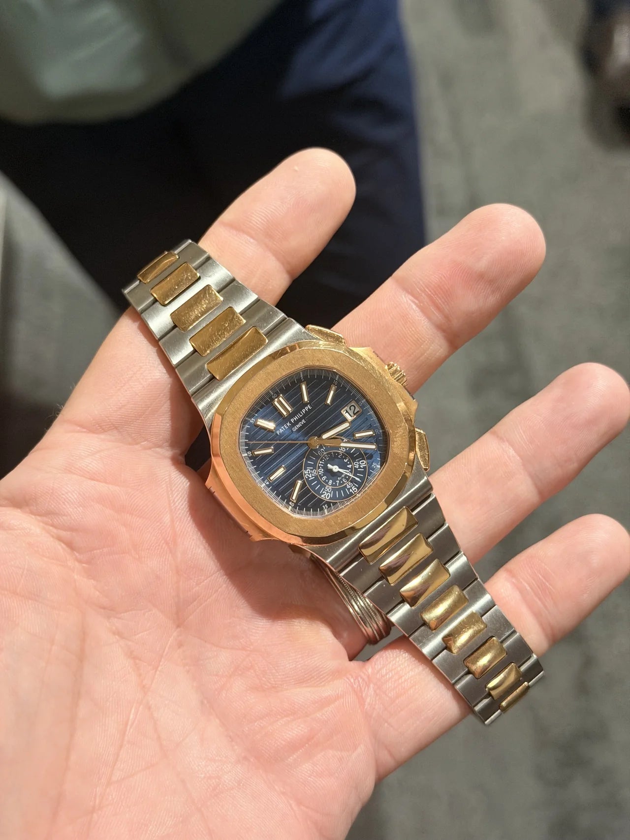 Blue dial watch with a gold-tone case and two-tone bracelet